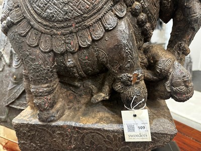 Lot 109 - A pair of carved wooden elephants