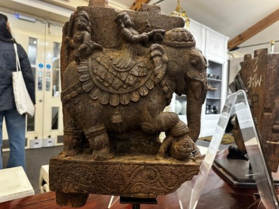 Lot 109 - A pair of carved wooden elephants