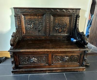 Lot 470 - A mid-Victorian carved oak hall seat