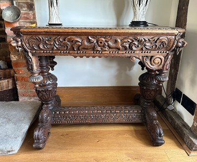 Lot 476 - A mid-Victorian carved oak centre table