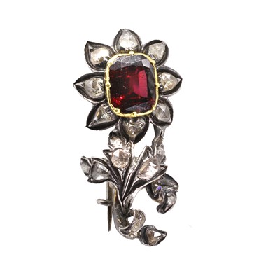 Lot 8 - An antique garnet and rose cut diamond floral brooch