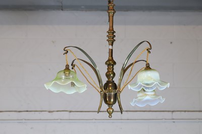 Lot 8 - A pair of Arts and Crafts brass four-branch ceiling lights