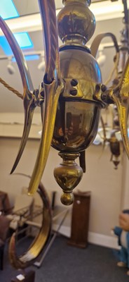 Lot 8 - A pair of Arts and Crafts brass four-branch ceiling lights