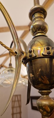 Lot 8 - A pair of Arts and Crafts brass four-branch ceiling lights