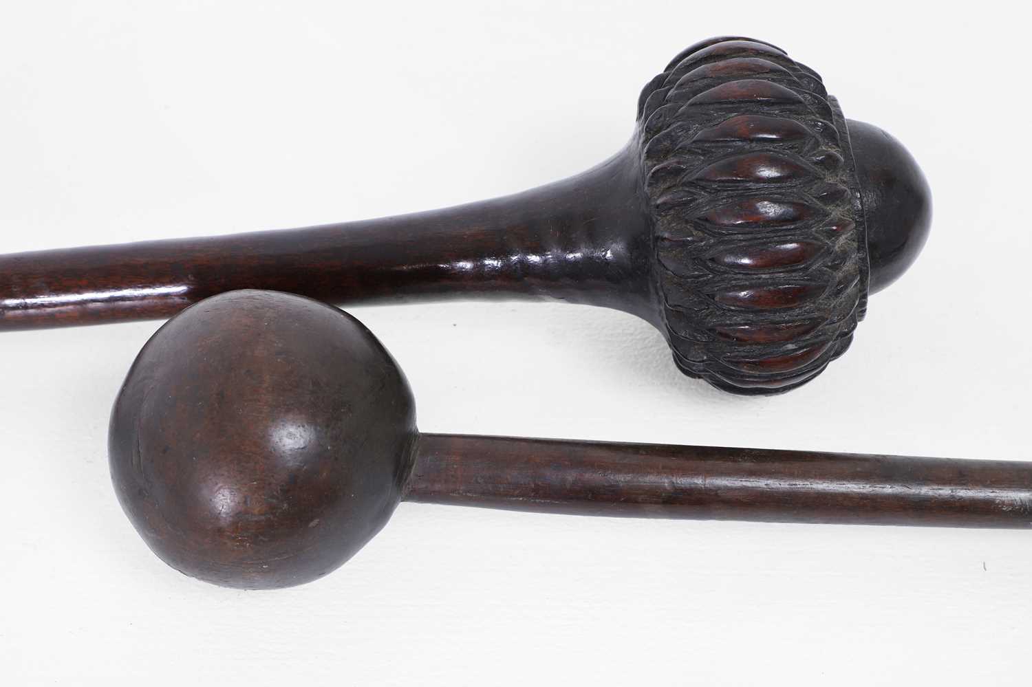 Lot 377 - Two Oceanic wooden throwing clubs