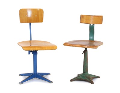 Lot 673 - Two wood and metal swivel chairs