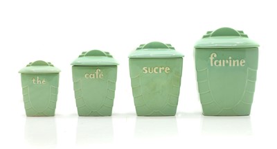 Lot 121 - A group of four St Clement Art Deco pottery kitchen storage jars