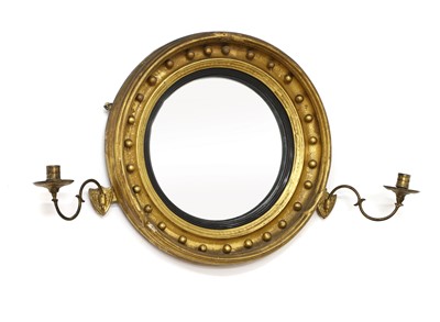 Lot 412 - A gilt convex wall mirror