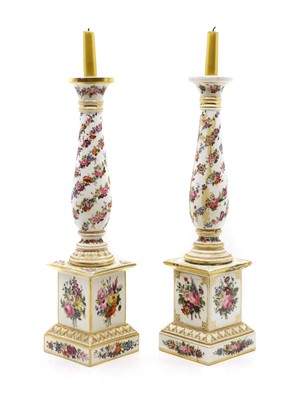 Lot 118 - A pair of porcelain candlesticks