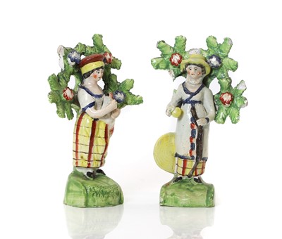 Lot 110 - A pair of Pratt-type pottery figures