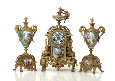 Lot 209 - A Louis XVI style gilt metal clock garniture