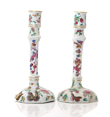 Lot 54 - A pair of Chinese porcelain candlesticks