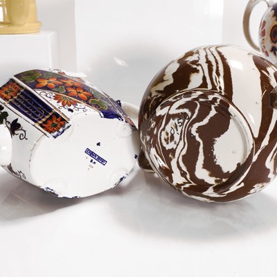 Lot 201 - Eight pottery teapots and covers