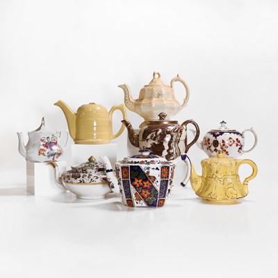Lot 201 - Eight pottery teapots and covers