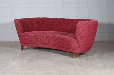 Lot 244 - A plum moquette banana sofa