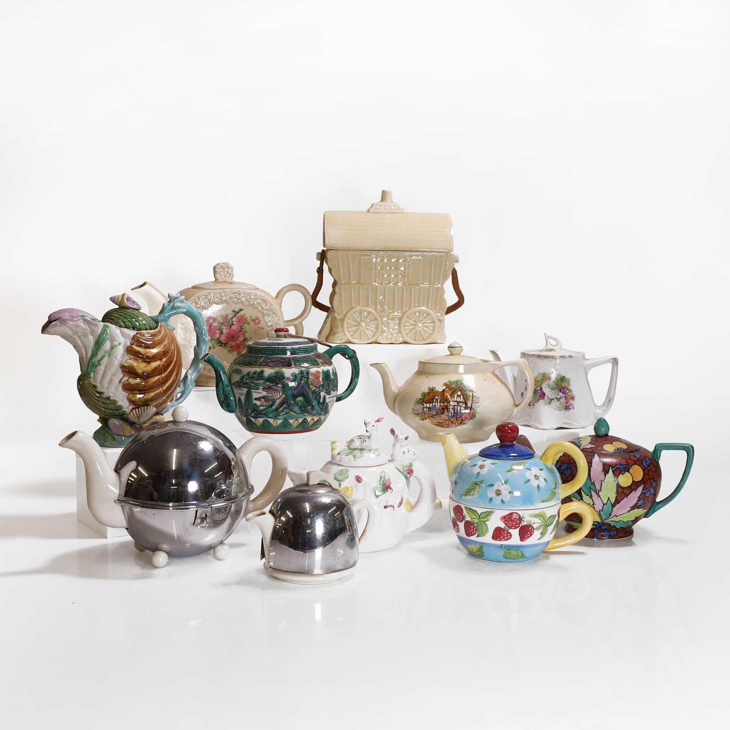 Lot 204 - Ten pottery teapots and covers