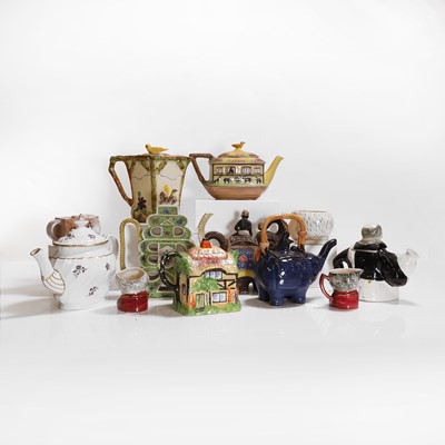 Lot 198 - A collection of pottery and porcelain teapots and covers