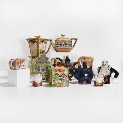 Lot 198 - A collection of pottery and porcelain teapots and covers