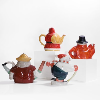 Lot 179 - Four figural pottery teapots and covers