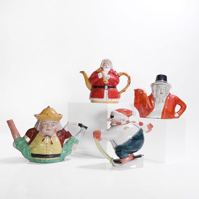 Lot 179 - Four figural pottery teapots and covers