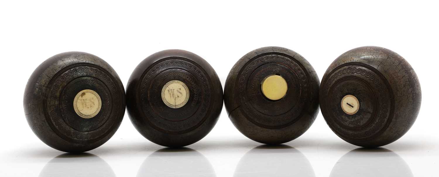 Lot 281 - A set of four lignum vitae lawn bowls