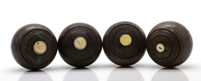 Lot 365 - A set of four lignum vitae lawn bowls