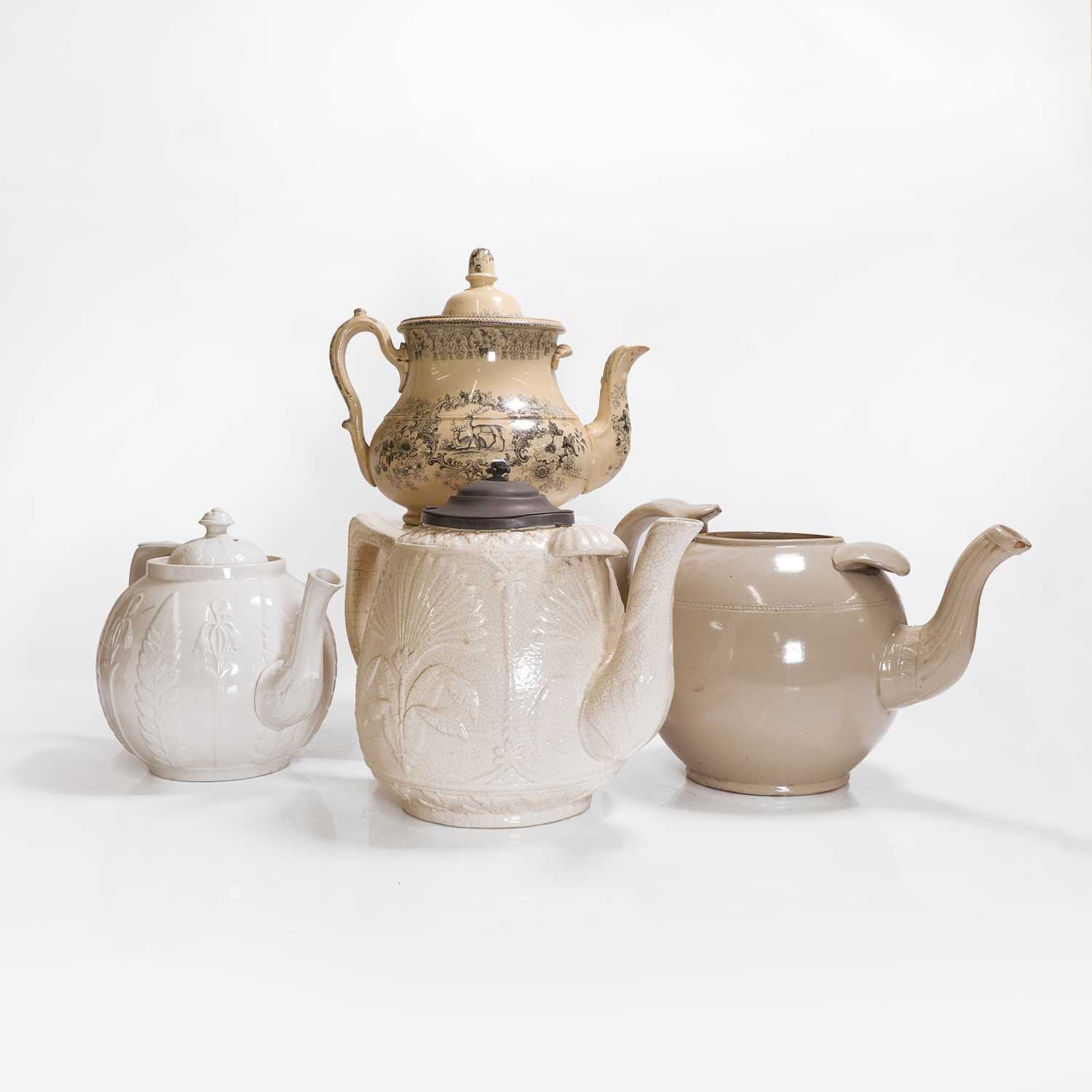 Lot 208 - Four large pottery teapots