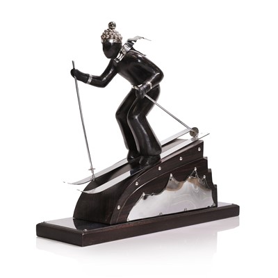 Lot 81 - An Art Deco-style carved wood and simulated coromandel skier centrepiece