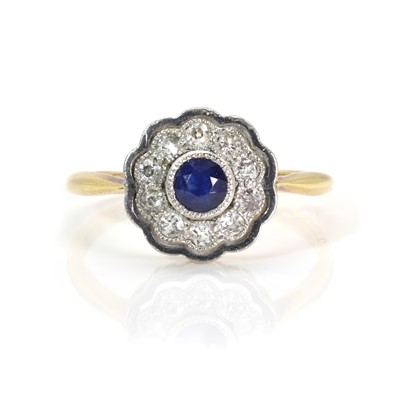 Lot 38 - A sapphire and diamond cluster ring