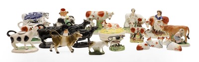 Lot 102 - A collection of cow creamers