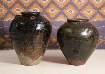 Lot A black glazed stoneware water jar