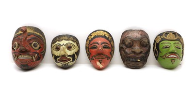 Lot 297 - Five Balinese carved and painted Barong masks