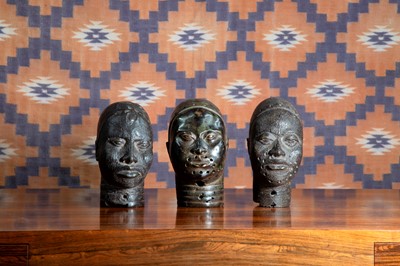 Lot A group of three Benin bronze heads.