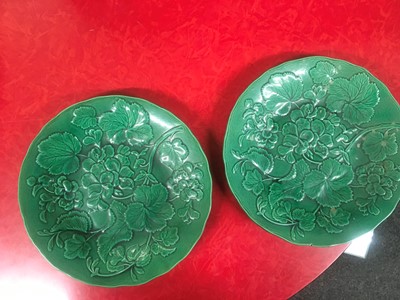 Lot 158 - Twenty green-glazed majolica plates
