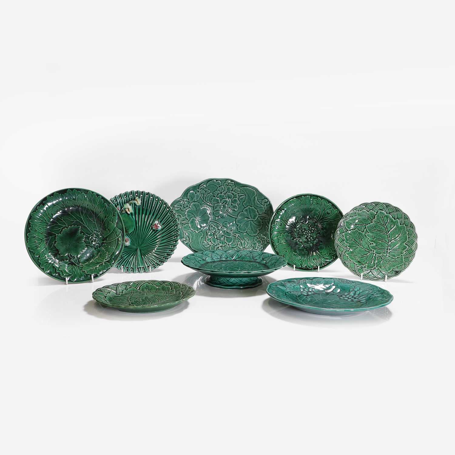 Lot 158 - Twenty green-glazed majolica plates