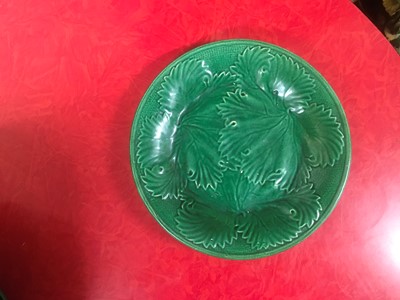 Lot 158 - Twenty green-glazed majolica plates