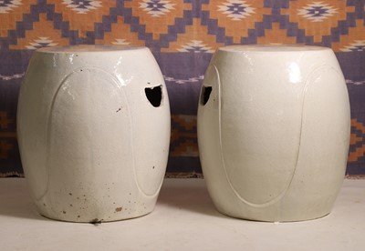 Lot A pair of cream glazed stoneware barrel seats