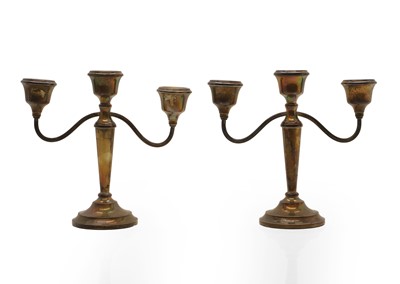 Lot 19 - A pair of silver candelabra