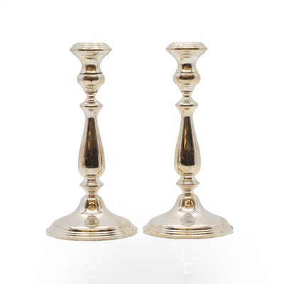 Lot 12 - A pair of silver candlesticks