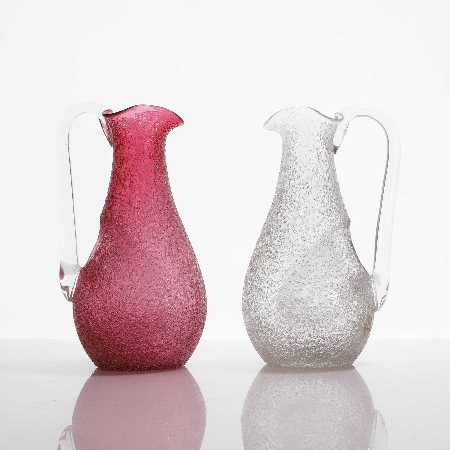 Lot 108 - Two glass champagne jugs