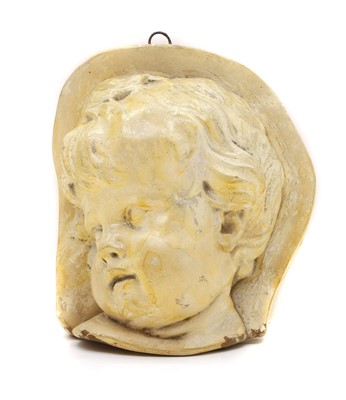 Lot 163 - A pottery bas relief of a sleeping child