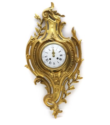 Lot 217 - A gilt bronze cartel clock