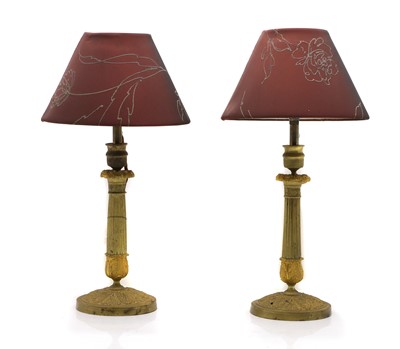 Lot 428 - A pair of gilt metal table lamps