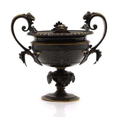 Lot 240 - A bronze twin handled urn