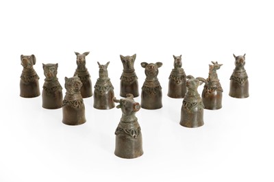 Lot 67 - A set of twelve Chinese bronze stirrup cups