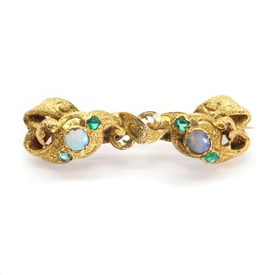 Lot 11 - An early Victorian emerald and opal scrolling brooch