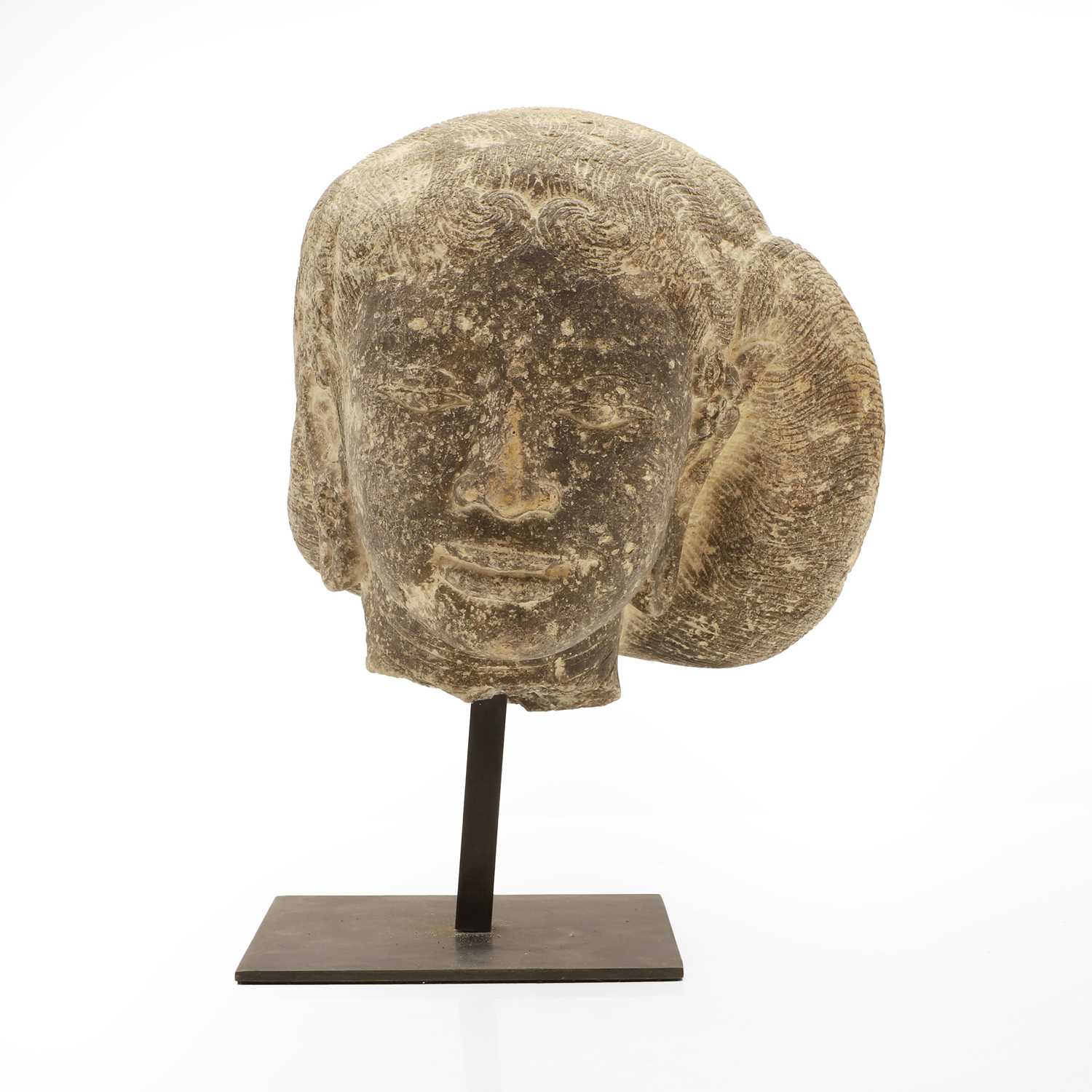 Lot 50 - A carved stone head