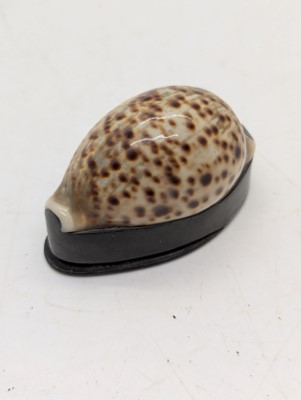 Lot 130 - Two cowrie shell snuff boxes