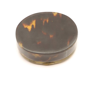 Lot 132 - A tortoiseshell and brass mounted oval snuff box