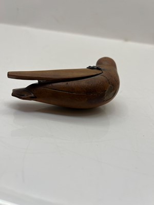 Lot 111 - A carved bird snuff box